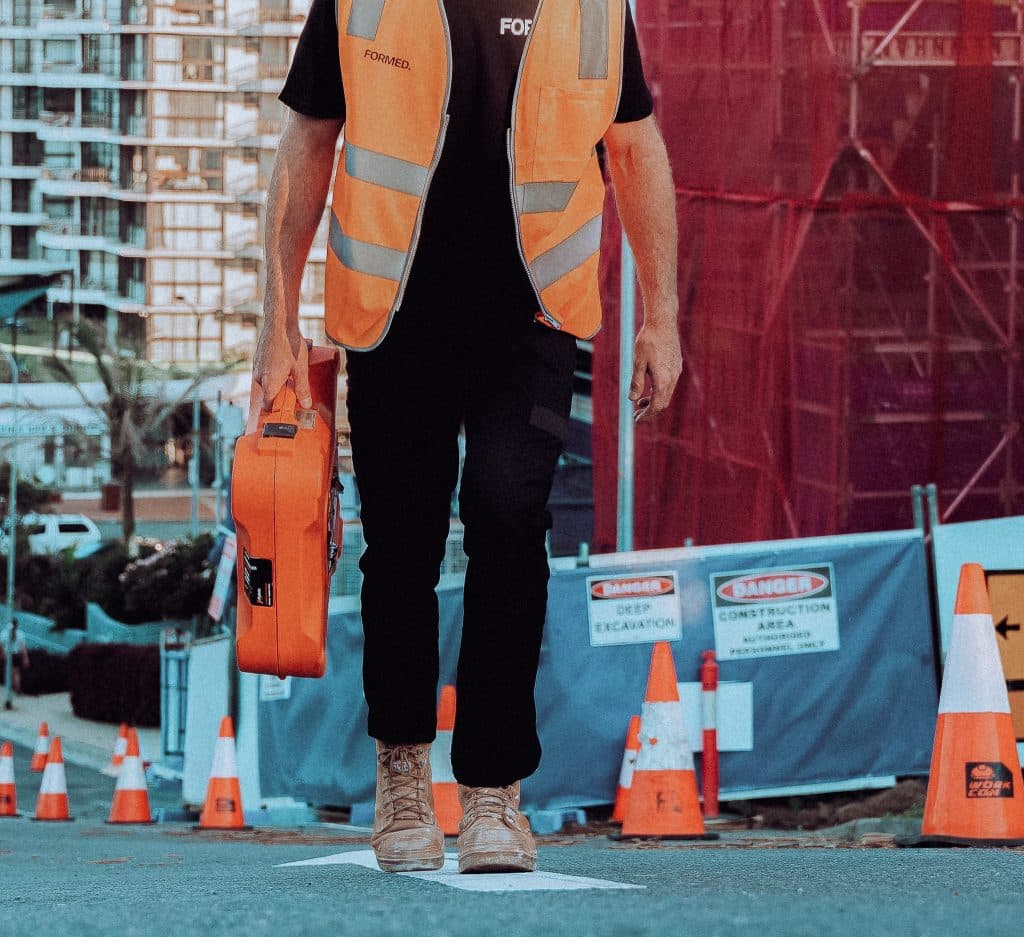 Carpenter walking through commercial construction site